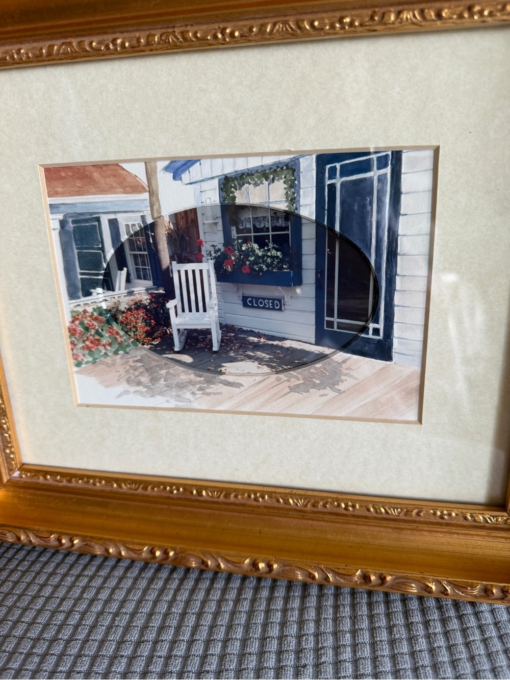 Framed Coastal Porch Print with White Rocking Chair and Flowers